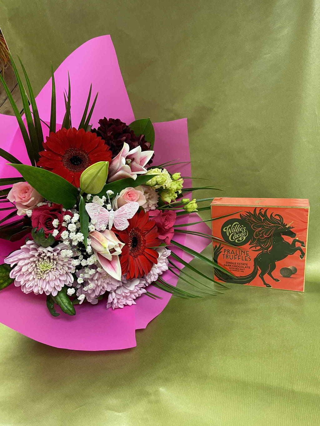 Small Hand tied bouquet with Willie’s Cacao Praline Truffles. Flowers color selection: Yellow and purple, purple and white, pink and white , red and pink.