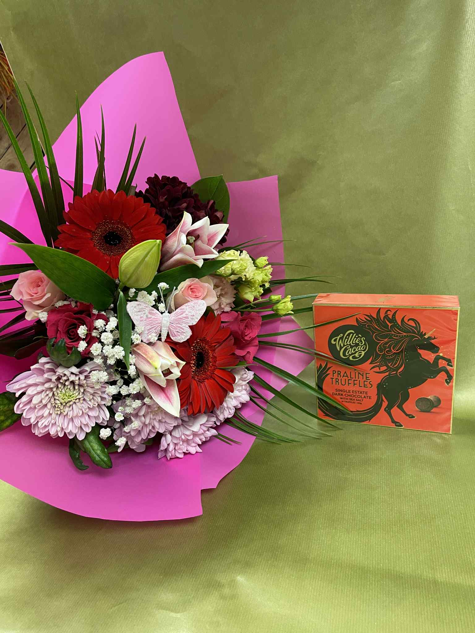 Small Hand tied bouquet with Willie’s Cacao Praline Truffles. Flowers color selection: Yellow and purple, purple and white, pink and white , red and pink.