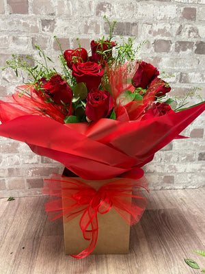 LOVE POTION. 12 RED ROSES BOUQUET