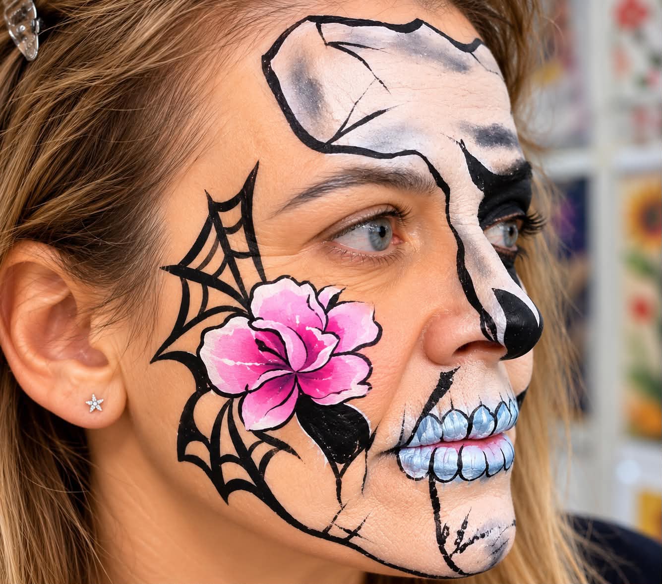 Pink flower and skull face painting